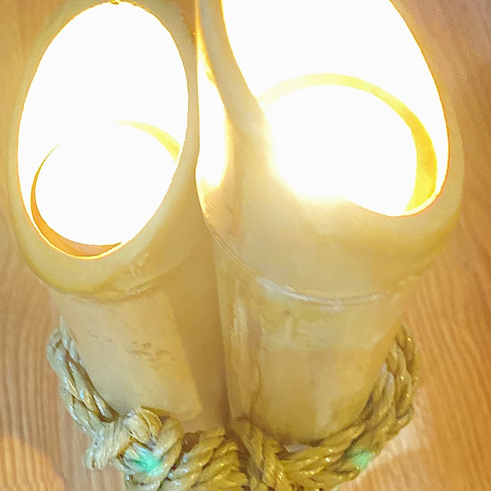Three multi length, natural, bamboo tea light candle holders.